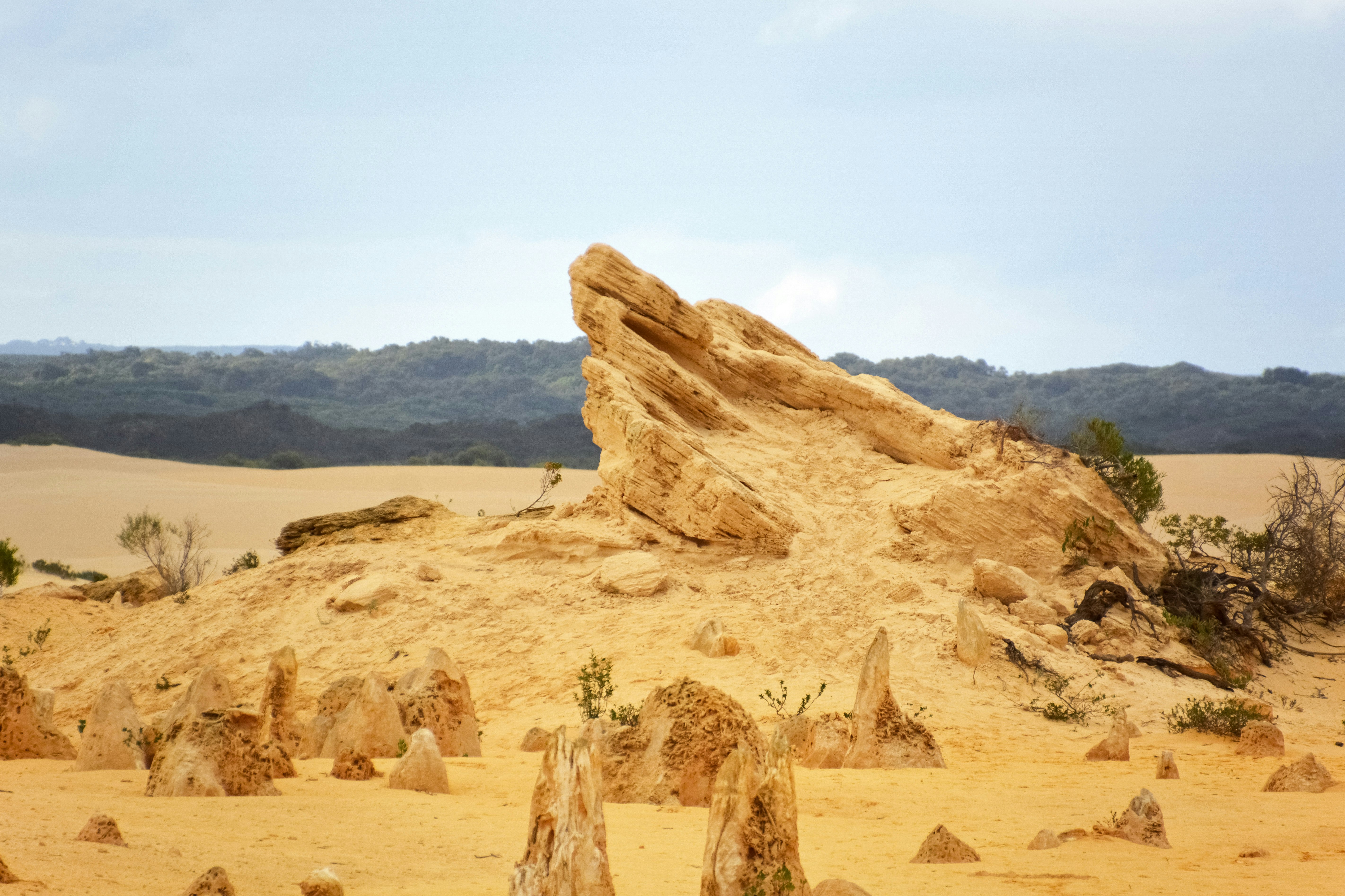 brown rock formation under white sky during daytime